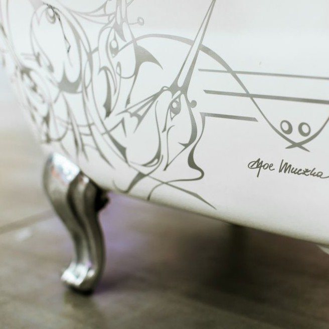 Freestanding bathtub with line graphics by Joe Muczka jr.
