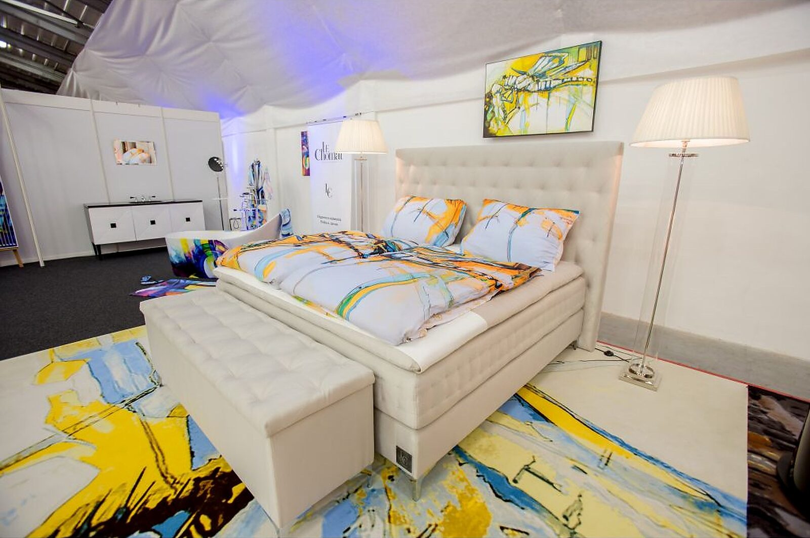 Bedroom with motif bed linen and a motif rug by Joe Muczka jr., For Interior fair, Prague 2018